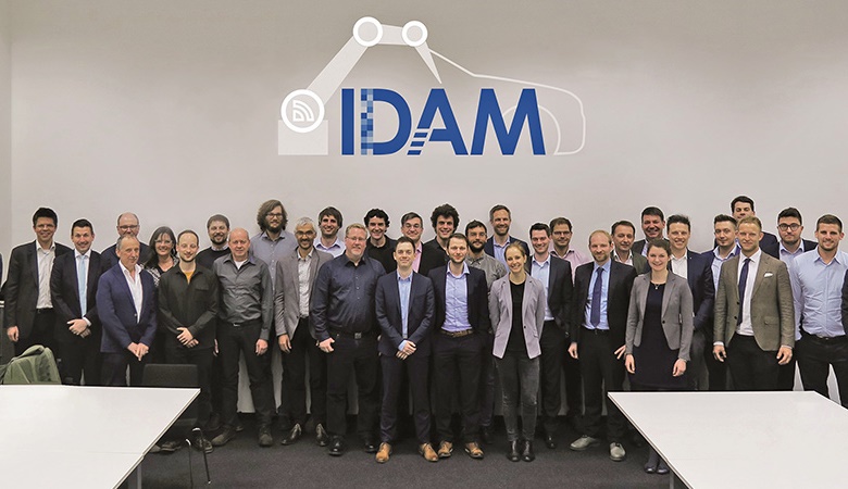 Idam Team Photo in a conference room