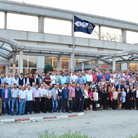 Team photo outside a GKNPM office