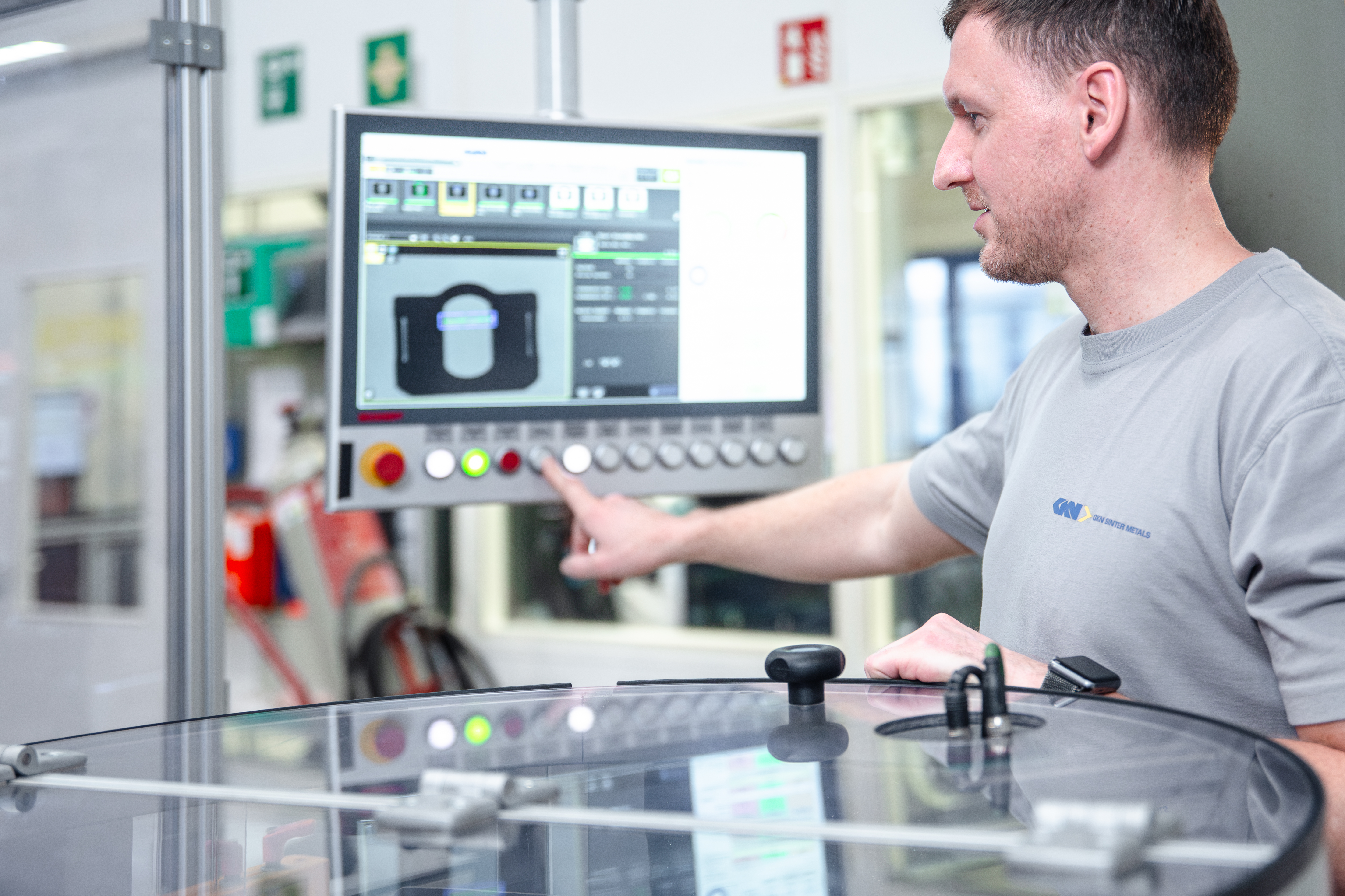 Man operating a machine in a factory