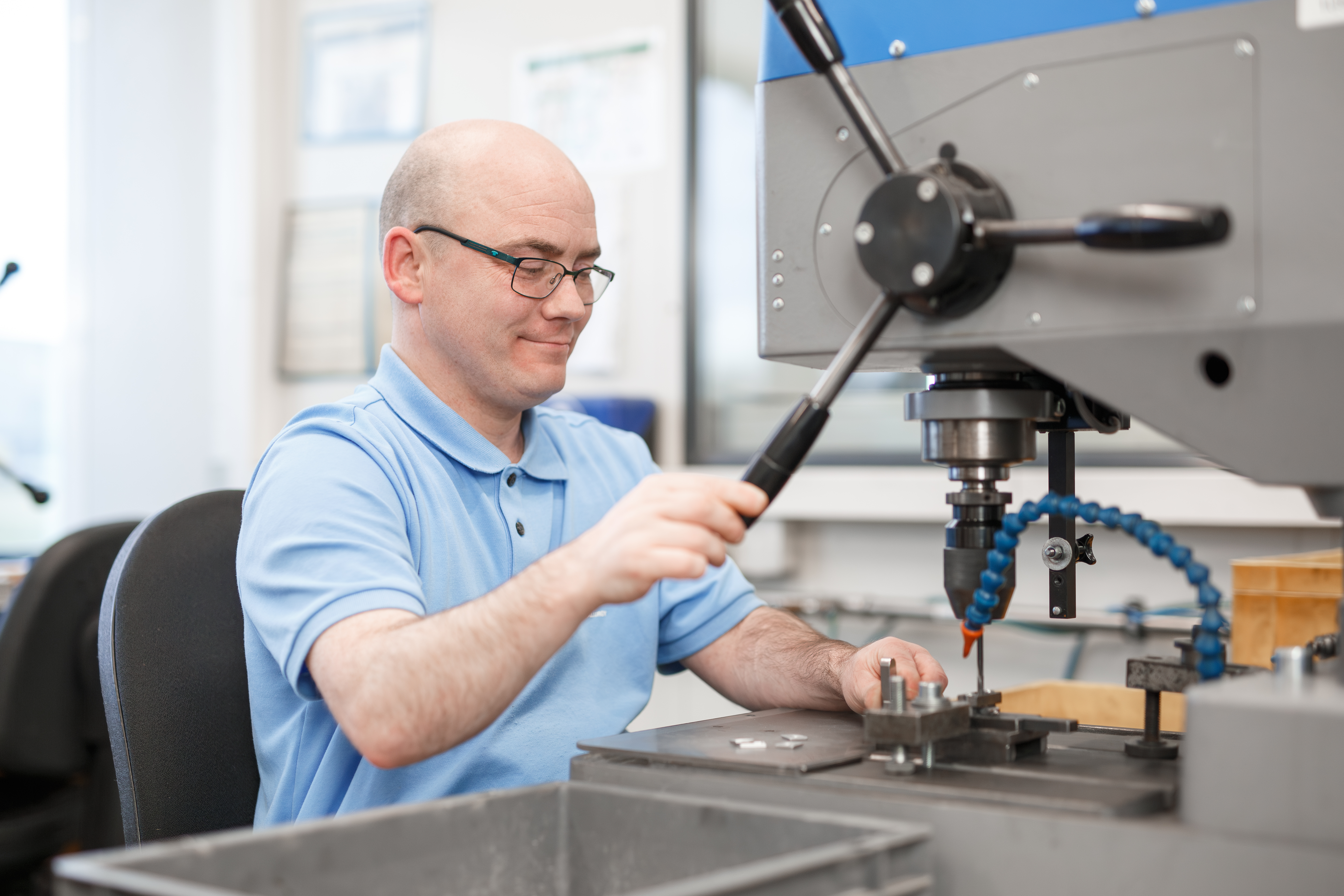 Factory worker using a machine